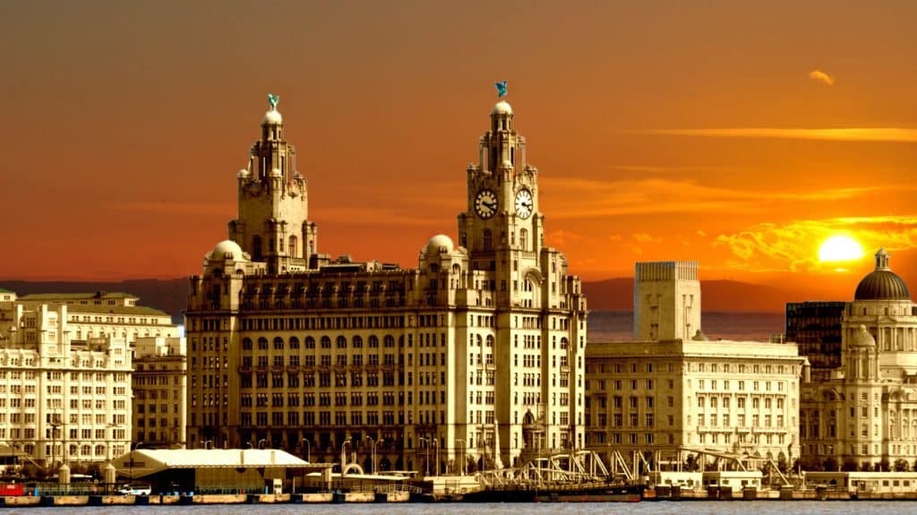 golden building in sunrise royal liver building liverpool